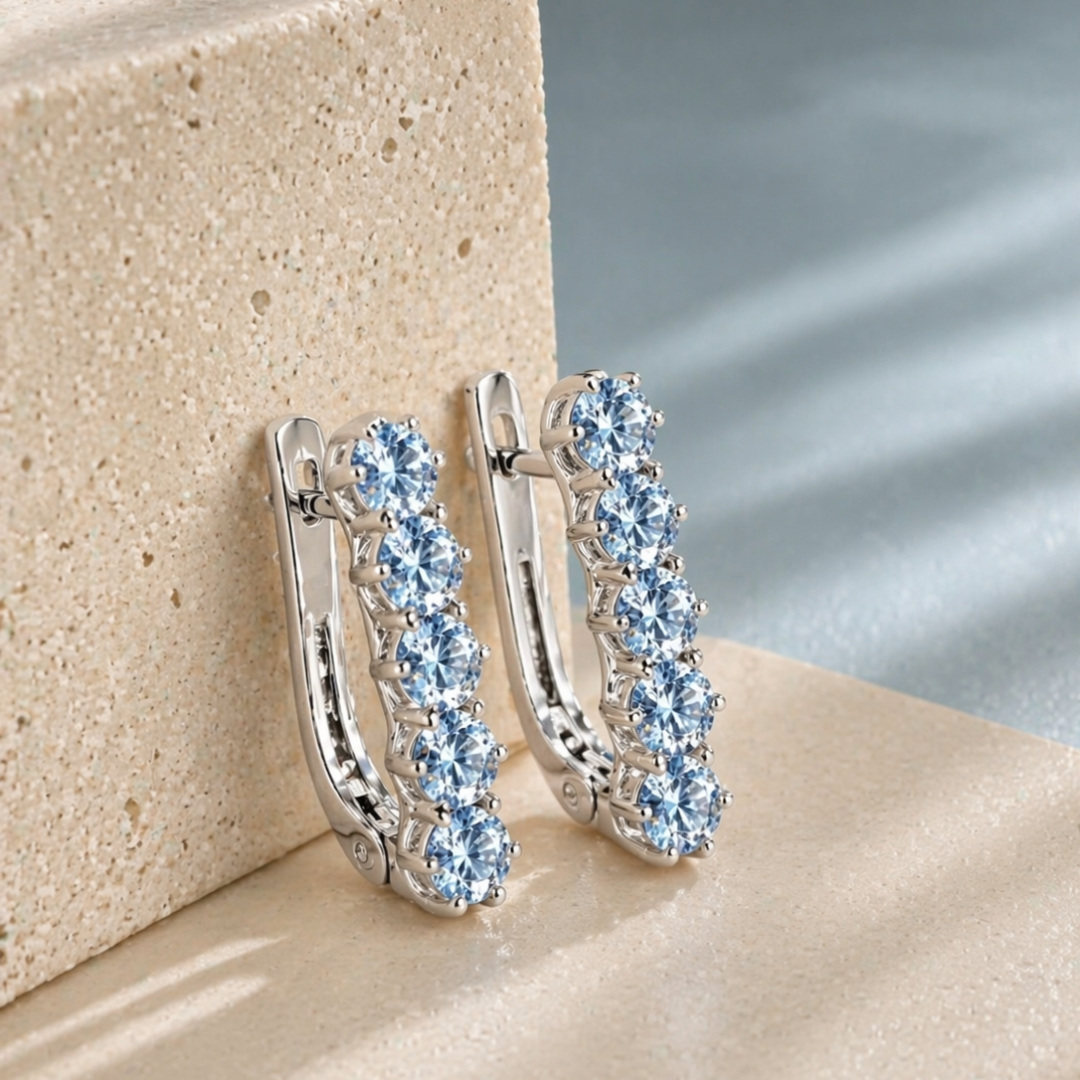 Blue Topaz Huggies