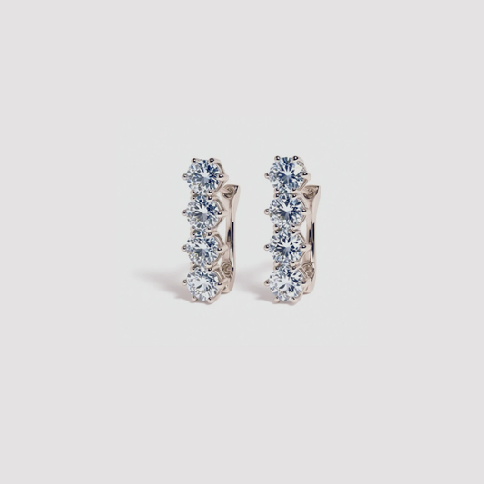 Blue Topaz Huggies